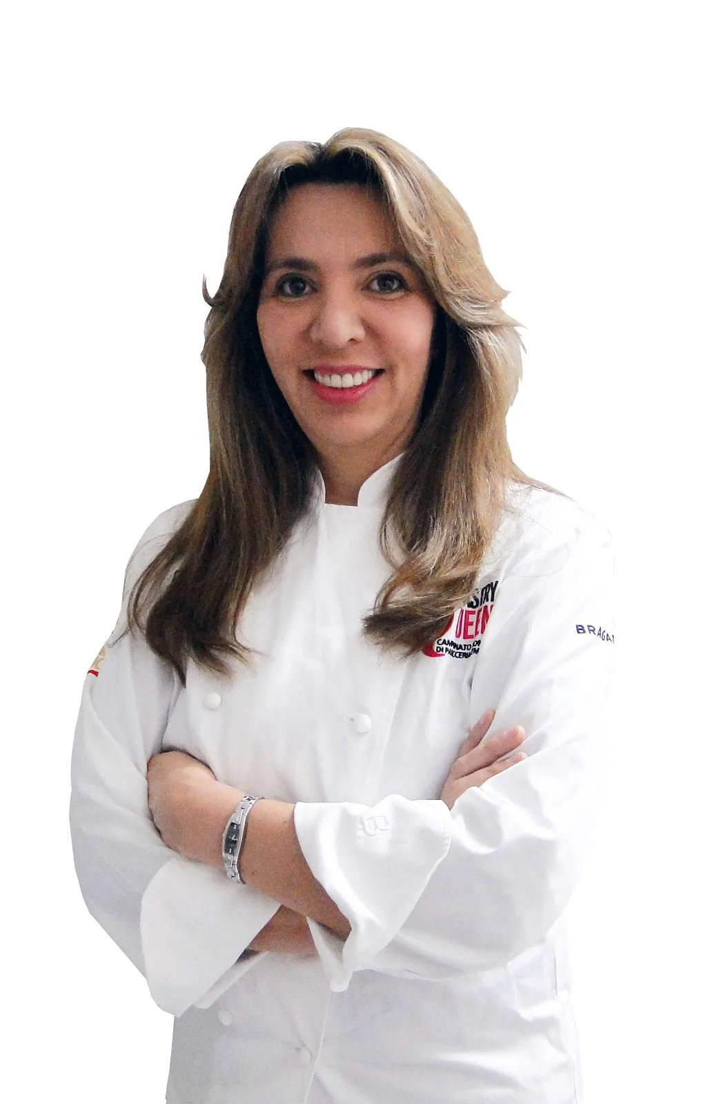 Retrato de Astrid Morales, con chaqueta blanca de chef y los brazos cruzados